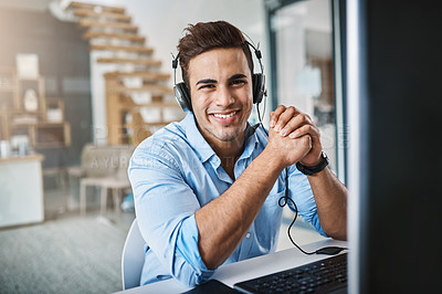 Buy stock photo Cropped portrait of a handsome young man working in a call center