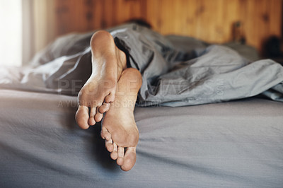 Buy stock photo Closeup shot of a man's dirty feet while he's sleeping in bed