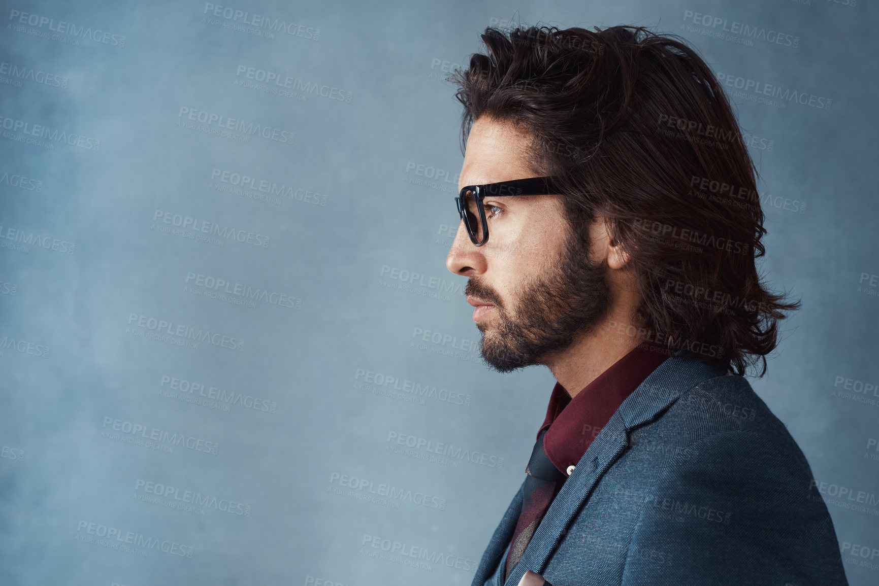 Buy stock photo Studio shot of a handsome and dapper young man posing against a grey background