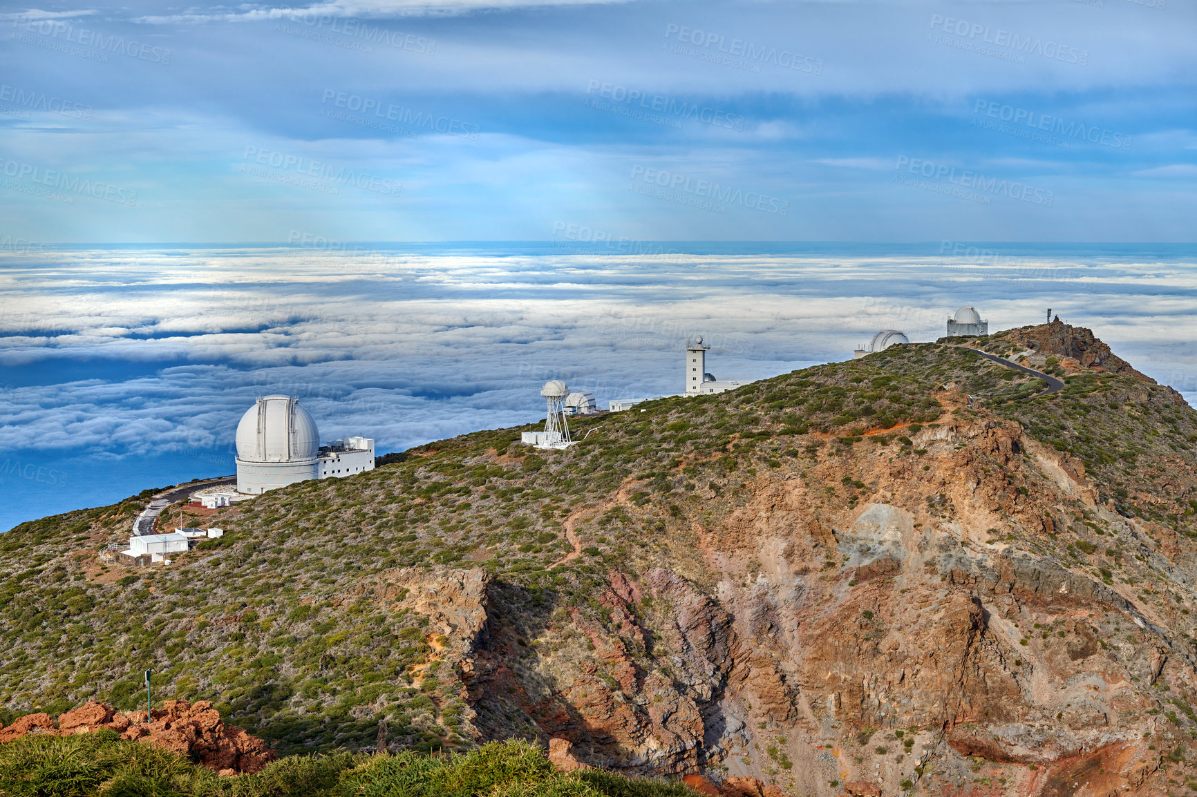 Buy stock photo Observatory to look at the cosmos on the mountain near the beach with copy space. Peaceful and scenic landscape at the sea with a peak or rock hill and blue sky background outdoors in nature