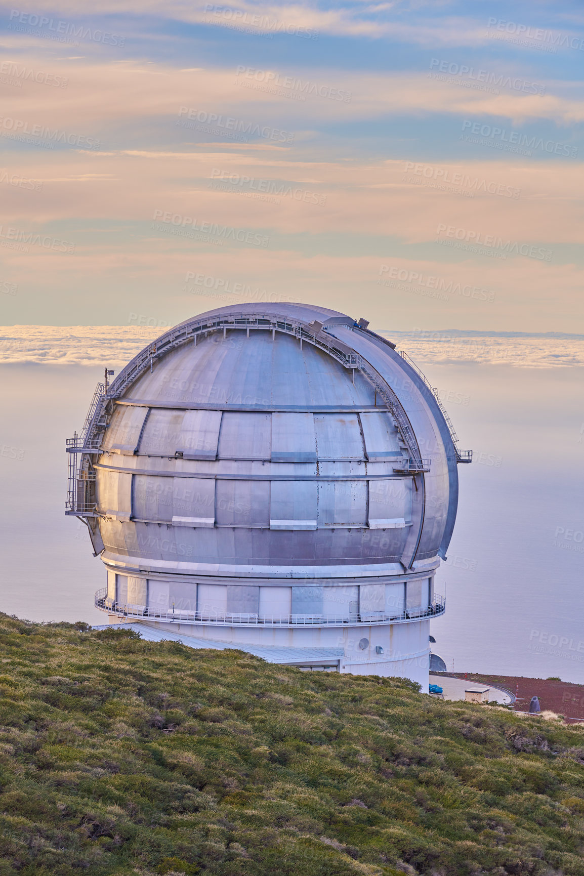 Buy stock photo Scenic view of an astronomy observatory dome in Roque de los Muchachos, La Palma, Spain. Landscape of science infrastructure or building against blue sky with clouds and copyspace abroad or overseas