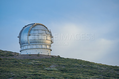 Buy stock photo Scenic view of an astronomy observatory dome in Roque de los Muchachos, La Palma, Spain. Landscape of science infrastructure or building against a blue sky and copy space. Tourism abroad or overseas