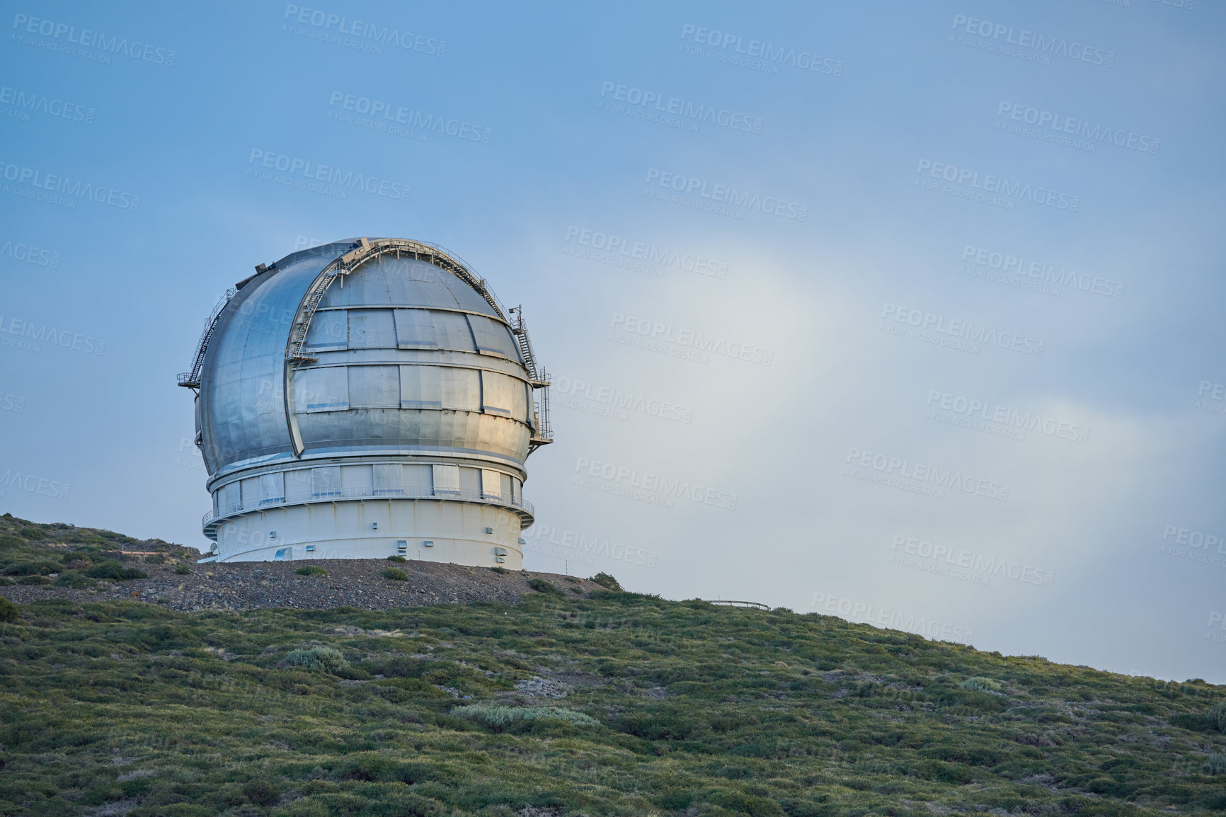 Buy stock photo Scenic view of an astronomy observatory dome in Roque de los Muchachos, La Palma, Spain. Landscape of science infrastructure or building against a blue sky and copy space. Tourism abroad or overseas