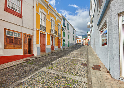 Buy stock photo Colorful buildings in the streets of Santa Cruz de La Palma. Houses or homes built in a vintage architecture design in a small town or village. The bright and vibrant city for vacations or holidays 