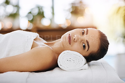 Buy stock photo Shot of a young woman feeling relaxed while lying on a spa bed