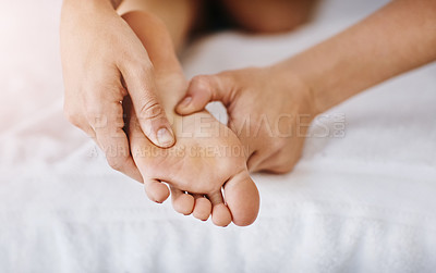 Buy stock photo Cropped shot of a woman getting a foot massage at a beauty spa