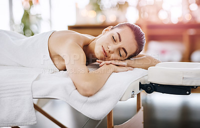 Buy stock photo Shot of a young woman relaxing on a spa bed