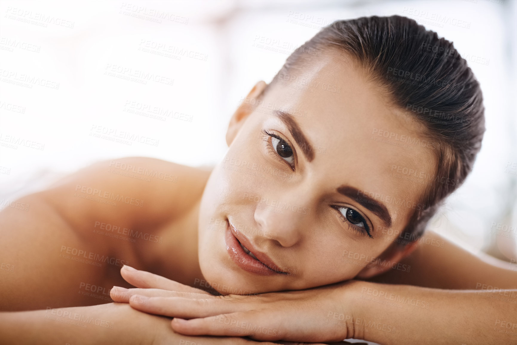 Buy stock photo Portrait of an attractive young woman getting pampered at a beauty spa