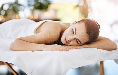 Buy stock photo Shot of a young woman relaxing on a spa bed