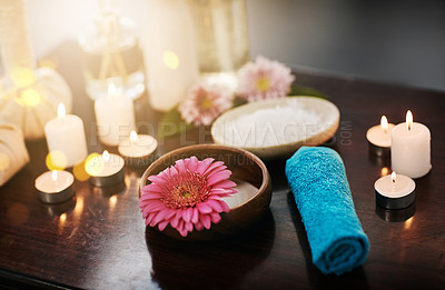 Buy stock photo Shot of various spa essentials arranged on a table
