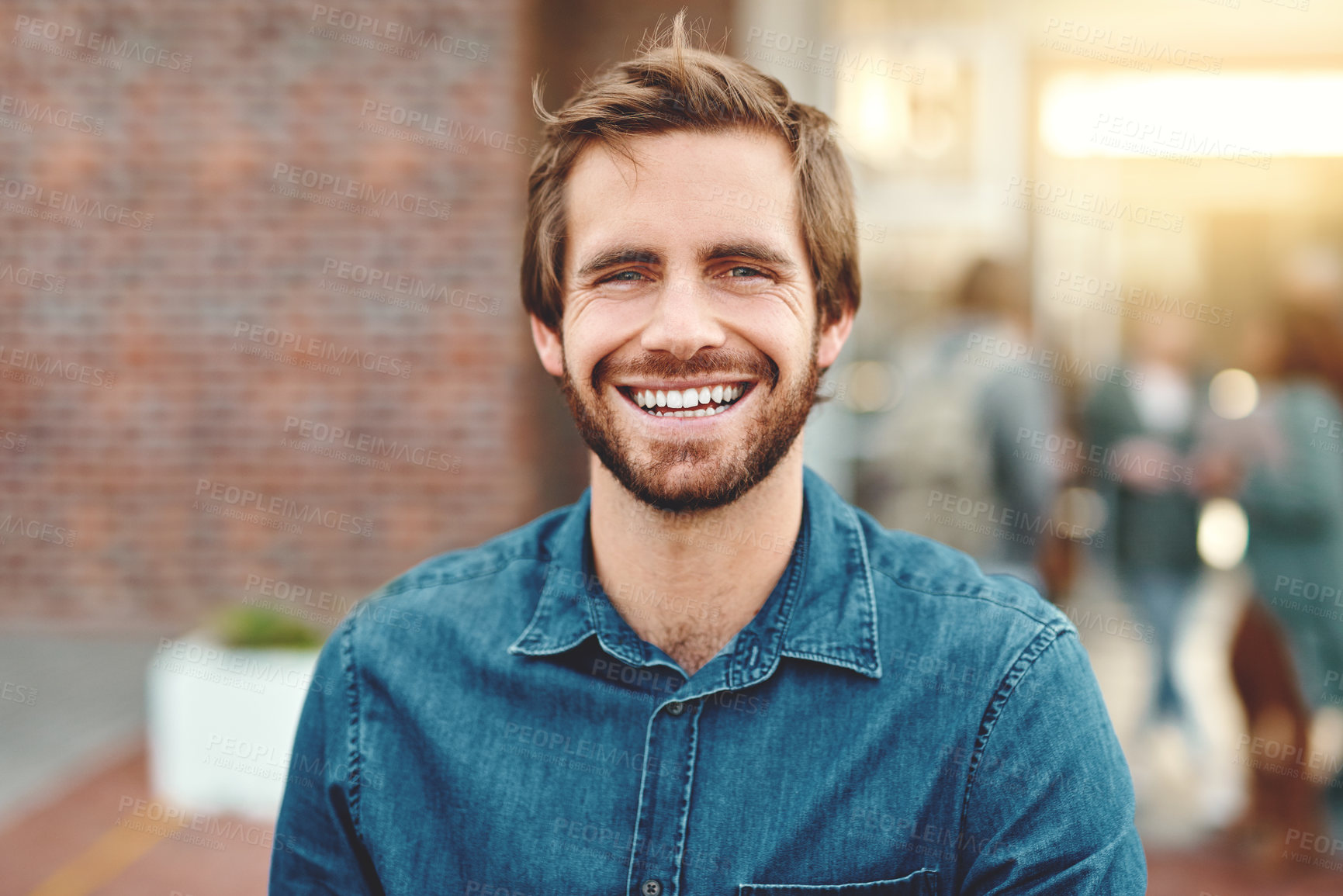 Buy stock photo Portrait of a happy young man standing outdoors on campus