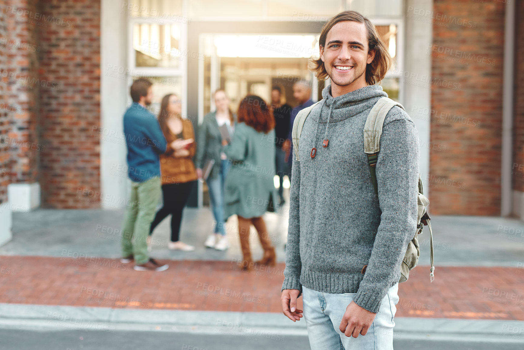 Buy stock photo Man, student and portrait in city, campus and backpack for education, learning or development at college. Person, happy and bag in metro street for scholarship, study or pride at university in Berlin