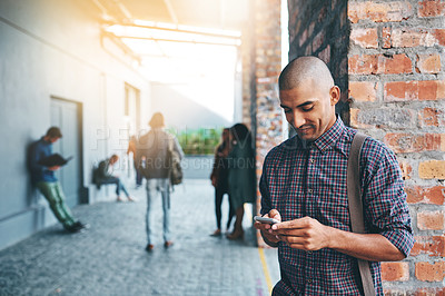 Buy stock photo Man, student and city with phone, texting or outdoor with typing for communication on mobile app. Person, smartphone or reading on metro sidewalk for commute to university with social media in Mexico