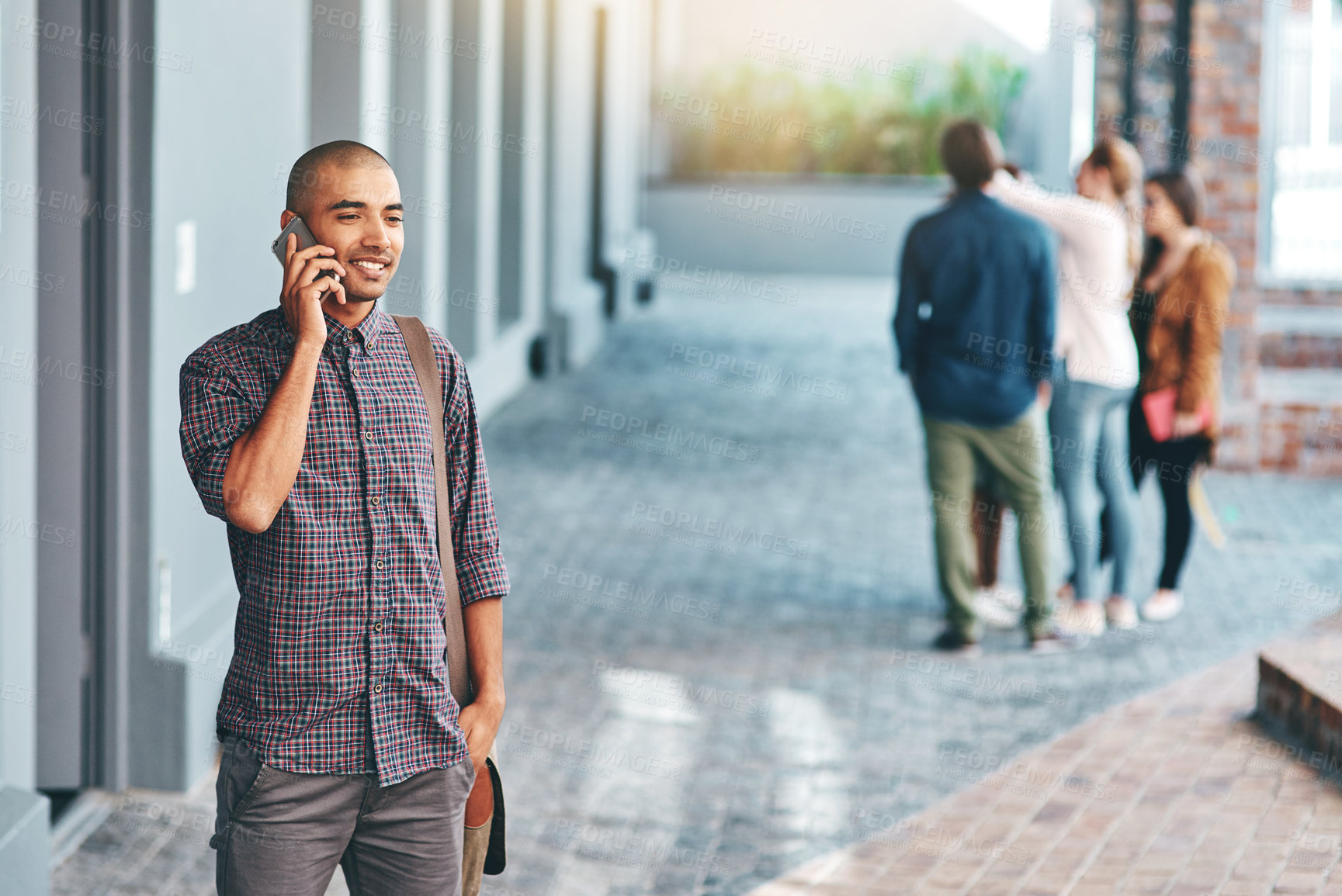 Buy stock photo Phone call, college and man on campus for education, knowledge and studying for online chatting. University, academy and happy person on smartphone for social networking, conversation and connection