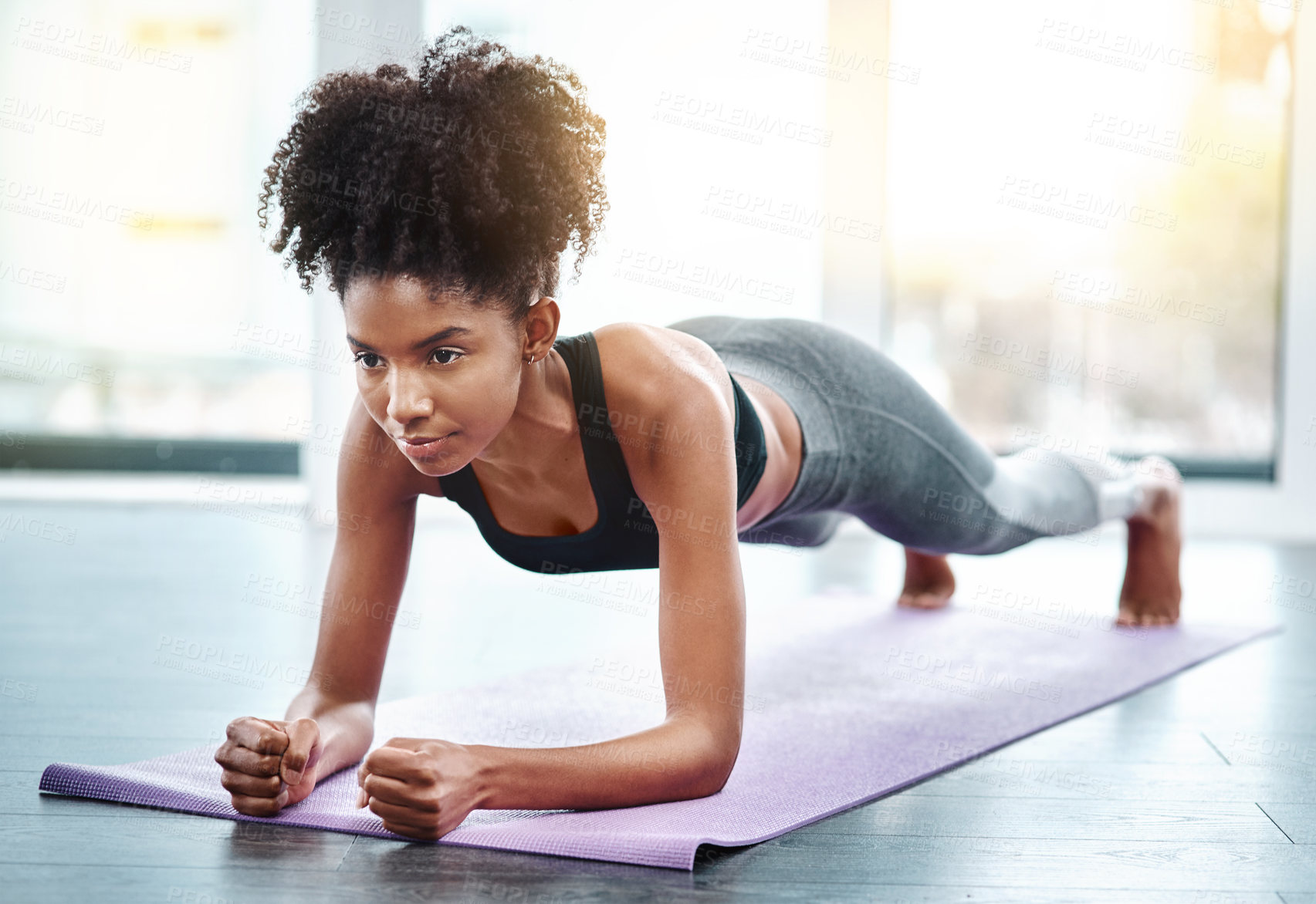 Buy stock photo Black woman, gym and plank for wellness on mat, core exercise and health club for body or strong abdomen. Balance, sportswear and muscles for fitness or training, serious athlete in pilates workout