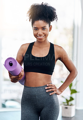 Buy stock photo Cropped shot of an attractive young woman holding her yoga mat