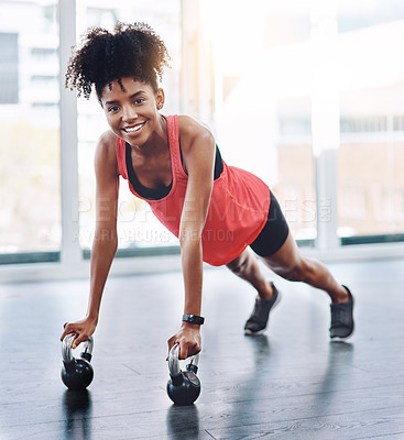 Buy stock photo Black woman, push up and kettlebell in gym portrait for fitness, strong arms and core in workout. Female person, training and body challenge for bodybuilder, resilience and lifting routine for health