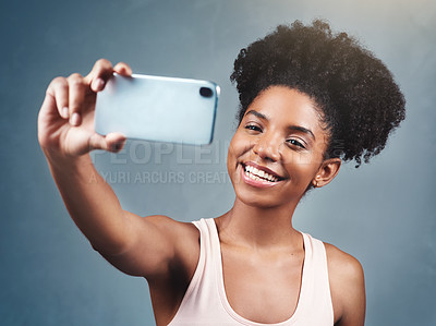 Buy stock photo Fitness, selfie and woman in studio for wellness, streaming or profile picture photography on grey background. Training, smile and social media health influencer with exercise blog content creation