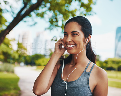 Buy stock photo Exercise, happy and woman in park with music for fitness, marathon training and running for wellness. Sports, relax and person with earphones listening to workout playlist, audio and radio on break