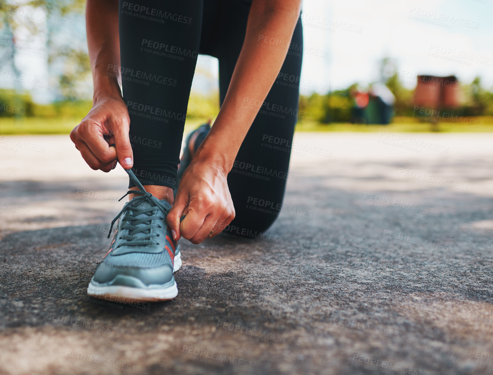 Buy stock photo Hands, shoes and tying lace with runner outdoor in park for start of exercise or fitness routine. Cardio, training and workout with athlete person getting ready for endurance, marathon or sports