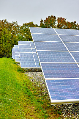 Buy stock photo Solar panel, field and renewable energy in nature, eco friendly production or power plant in summer. Photovoltaic tech, outdoor and landscape for clean electricity, environment and station in Denmark