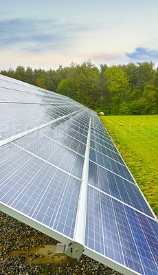 Buy stock photo Solar panel, field and clean electricity in nature, eco friendly production or power plant in summer. Photovoltaic tech, landscape and sustainability for renewable energy to save the earth in Denmark