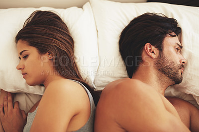 Buy stock photo Couple, bed and fight of sad people in a home with marriage conflict and problem. Divorce, fighting and above with woman and man in a bedroom in house at morning with depression for relationship