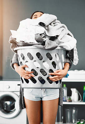 Buy stock photo Laundry, basket and pile of woman with clothes in her home for housework, washing or hygiene. House, cleaning and female carrying fresh fabric for spring clean, tidy and household task on the weekend