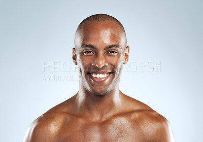Buy stock photo Studio shot of an cheerful athletic young man posing against a grey background