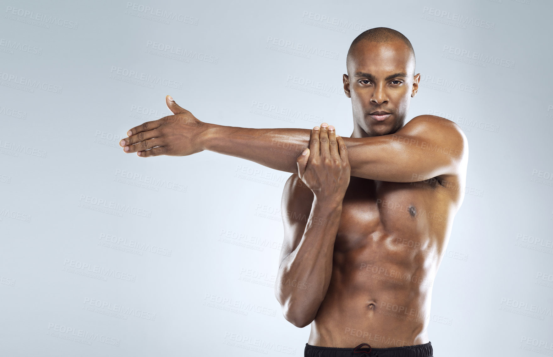 Buy stock photo Black man, stretching and portrait in topless for skincare, wellness and health with fitness in studio. African, male person and pride with muscle for body, workout and results in white background