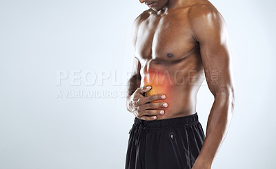 Buy stock photo Cropped shot of an unrecognizable athletic young man with cgi highlighting his injury against a grey background