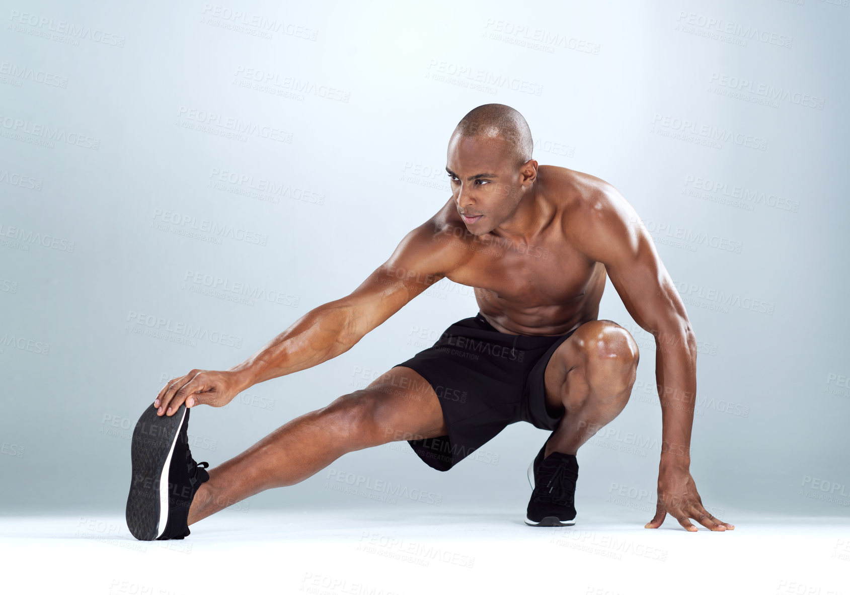 Buy stock photo Man, legs and stretching for fitness in studio for balance, exercise and calf muscle by white background. African person, bodybuilder and warm up on floor for training, workout and transformation