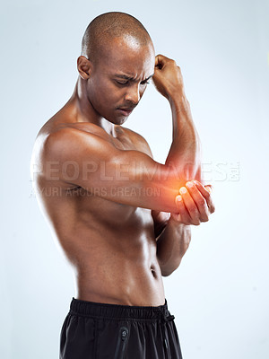 Buy stock photo Cropped shot of an athletic young man with cgi highlighting his injury against a grey background