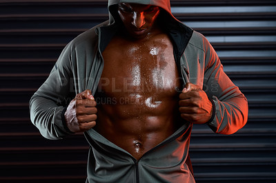 Buy stock photo Studio shot of an athletic young man posing against a grey background