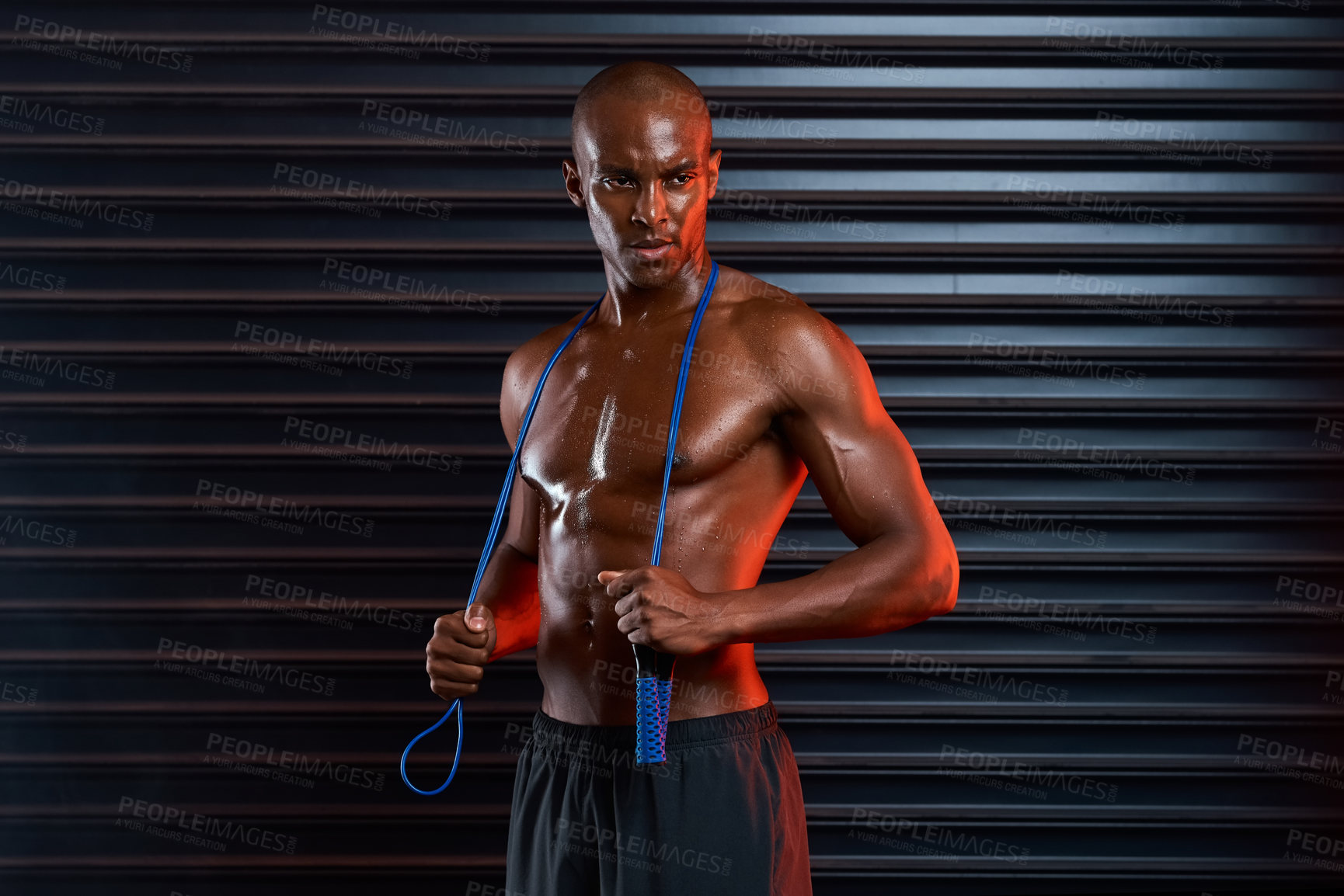 Buy stock photo African man, muscle and skipping rope of athlete, fitness and healthy for bodybuilding, abs and ready for exercise. Black background, competitive and person with strength, confidence or proud of body