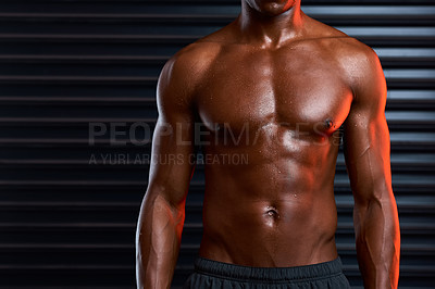 Buy stock photo Studio shot of an unrecognizable male athlete posing against a grey background