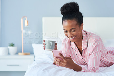 Buy stock photo Home, morning and bed for happy woman with smartphone, chatting or scroll on social media. African person, coffee cup and cellphone for mobile app, typing or text message on dating website in bedroom