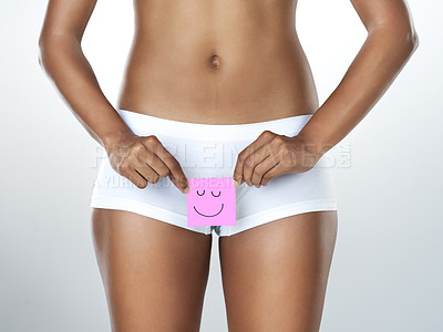 Buy stock photo Gynecology, paper and woman in underwear for feminine hygiene in studio with health and wellness. Smile, menstruation and female person or emoji isolated by white background for pms and self care