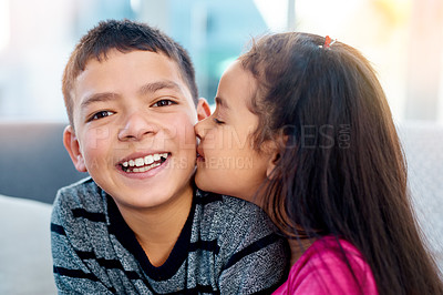 Buy stock photo Portrait, children and smile with kiss on cheek, cute and joy in family home as kids in youth. Siblings, happy and cuddle as brother and sister on couch for affection, love and childhood development