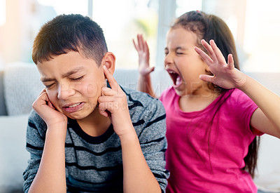 Buy stock photo Siblings, screaming and angry with fight in home for conflict, problem and frustrated on sofa. Boy, girl and young kids with tantrum in living room for dispute, upset and shouting in argument