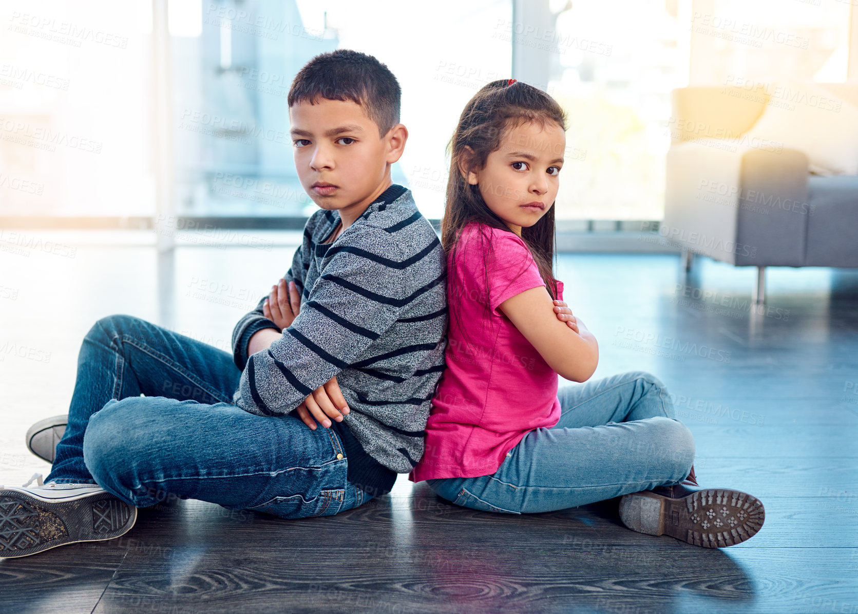 Buy stock photo Portrait, children and sitting with arms crossed after fight, anger and backs together on floor in house. Angry, brother and sister in home living room, fighting or argument, conflict or problem.