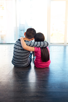 Buy stock photo Friends, hug and back of kids in home to relax together with care or support in happy family. Girl, brother or children embrace with love, kindness or siblings on holiday or vacation with trust
