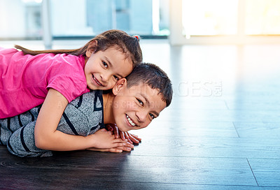 Buy stock photo Floor, playing and portrait of children in home for sibling bonding, relax and fun together. Family, happy 
 and young girl and boy for childhood, youth and playful on holiday, weekend and vacation