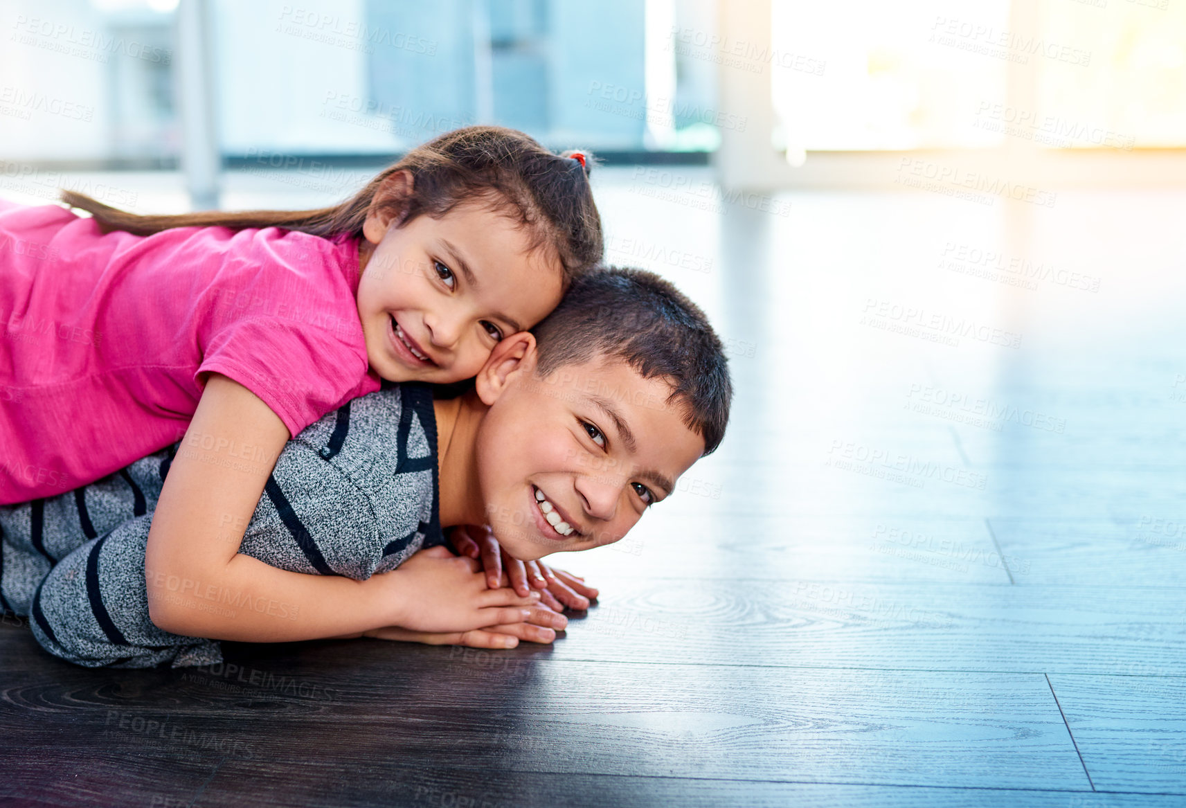 Buy stock photo Floor, playing and portrait of children in home for sibling bonding, relax and fun together. Family, happy 
 and young girl and boy for childhood, youth and playful on holiday, weekend and vacation