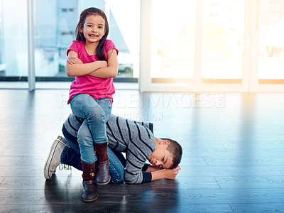 Buy stock photo Kids, play and funny siblings in home, brother and sister in living room. Daughter, smile and arms crossed on boys back for childhood fight or bullying, sad and annoyed son on floor of family house