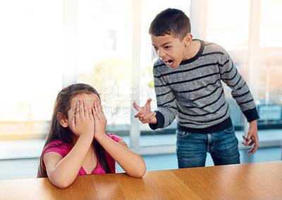 Buy stock photo Scream, siblings and children in argument in home for conflict, bullying or discipline with sadness. Upset, angry and boy shouting at girl for fighting with frustration by table in house together.