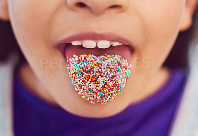 Buy stock photo Shot of an unrecognizable little girl posing with her tongue showing at home