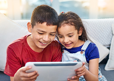 Buy stock photo Tablet, children and siblings on couch for play, online and esports for entertainment. Technology, streaming and internet for video in home, smile or gaming on digital app games on touchscreen
