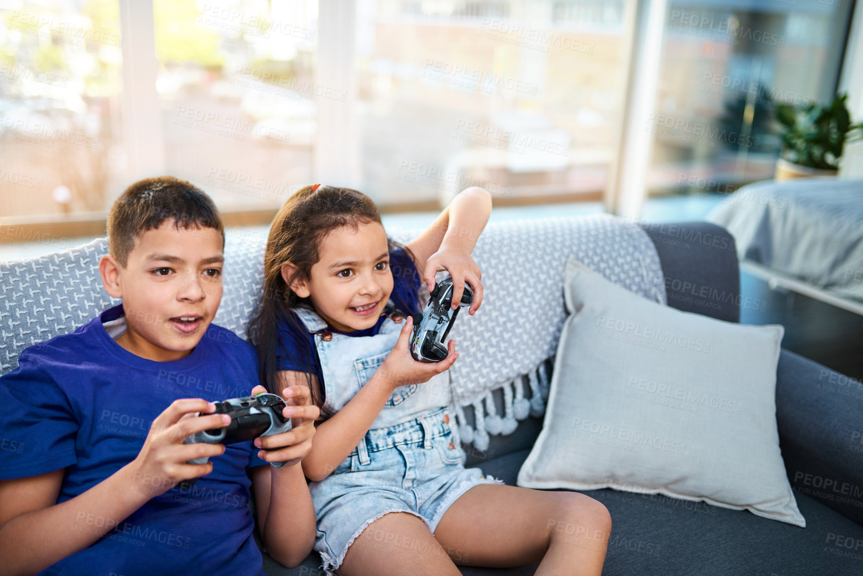 Buy stock photo Children, siblings and video game with controller, sofa and online for esports in home. Technology, entertainment and virtual challenge for brother and sister, console or couch in living room for fun