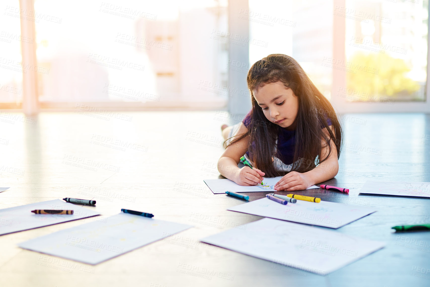 Buy stock photo Female child, writing and drawing on floor in house with color pencil for development. Girl, playing and learning in home with crayon or paper for kindergarten, homework and homeschool education